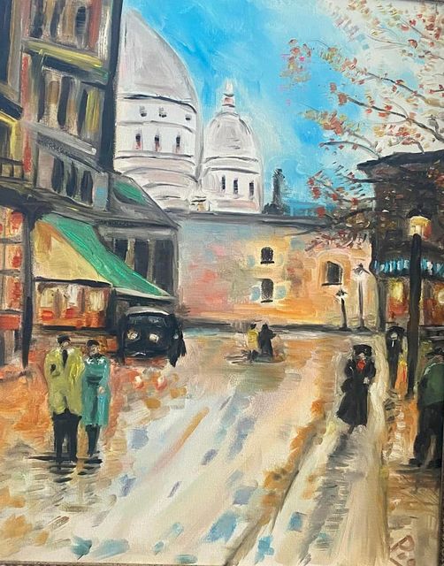 Paris street in autumn with the domes of Sacré-Cœur